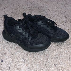 Kids all black Skechers sneakers